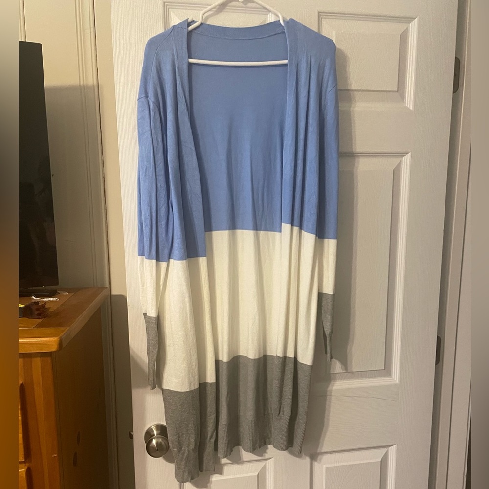 Long sweater with cool colors.